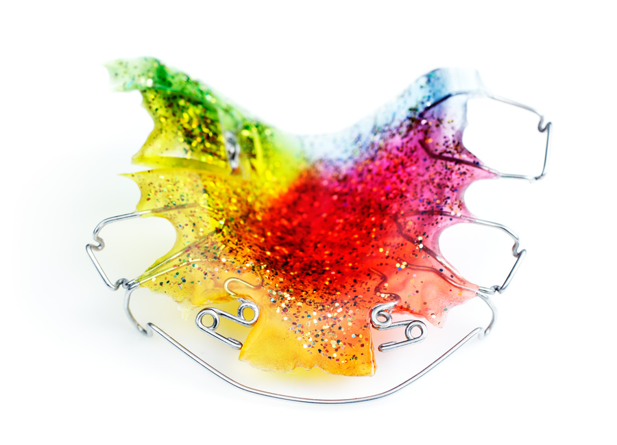 Multicolored and glittered orthodontic appliance for a child